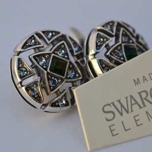 Silver earrings with green Swarovski stones.
